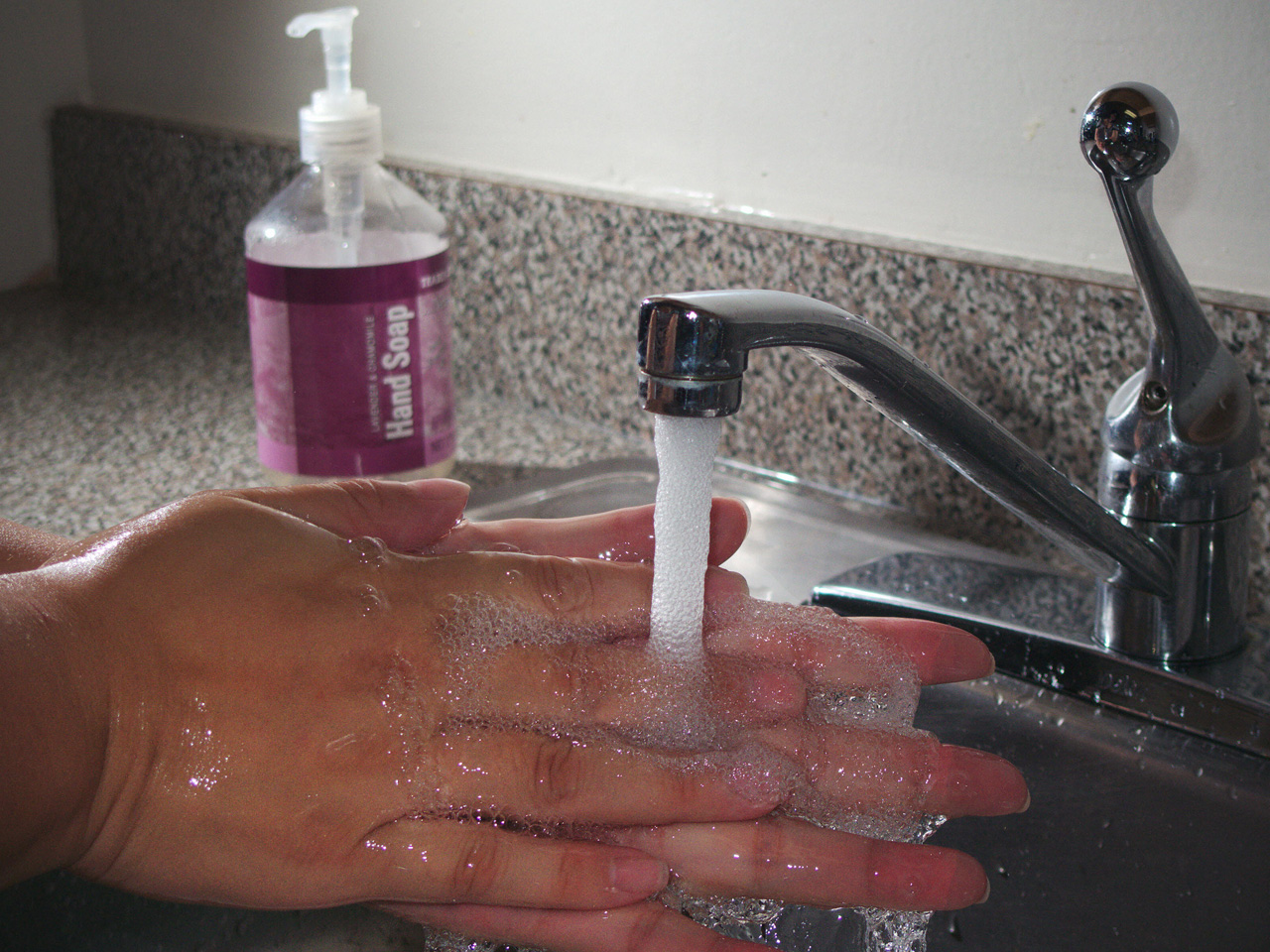 person washing hands