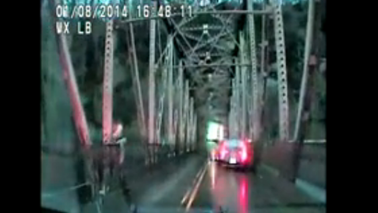 VIDEO Woman jumps off bridge in an attempt to flee police CBS News