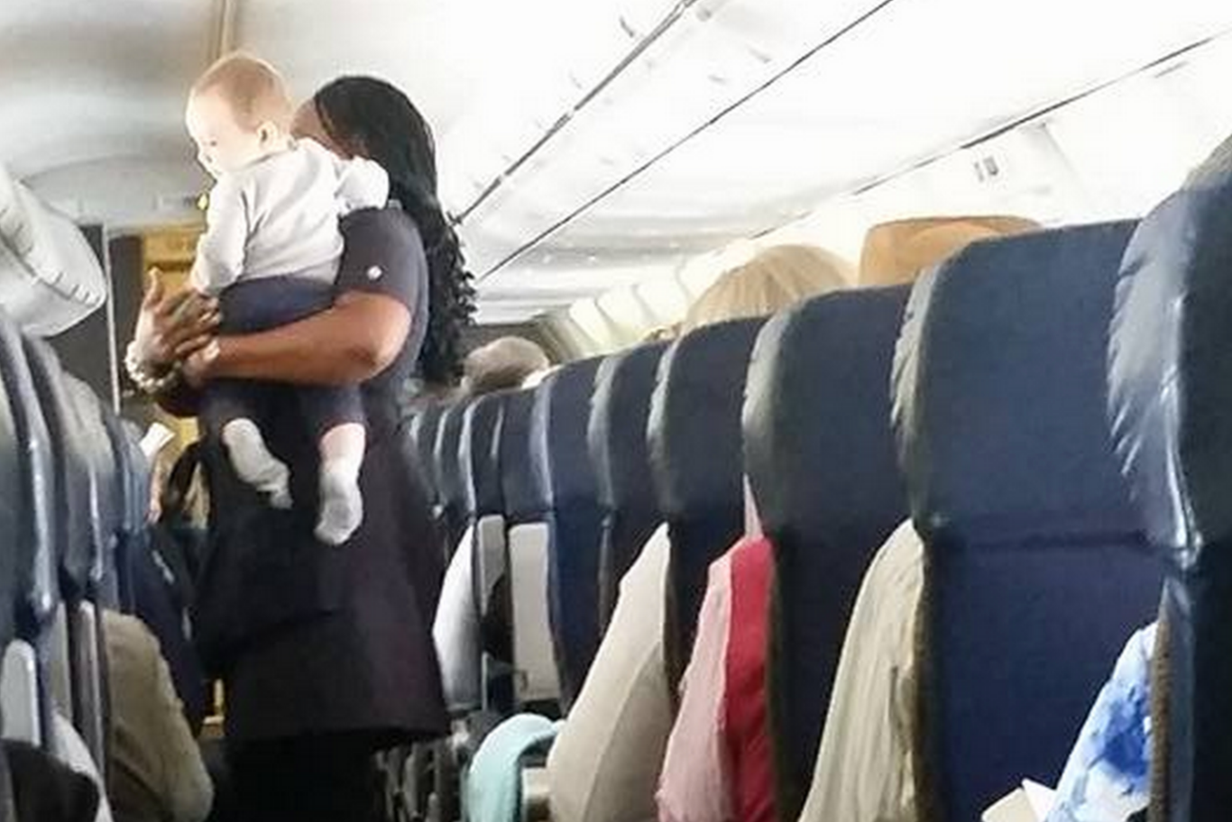 Southwest Airlines flight attendant calms stressed mom's antsy baby on