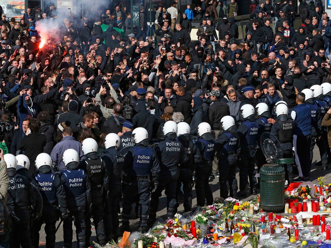 Rightwing "hooligans" battle Belgian police at shrine CBS News
