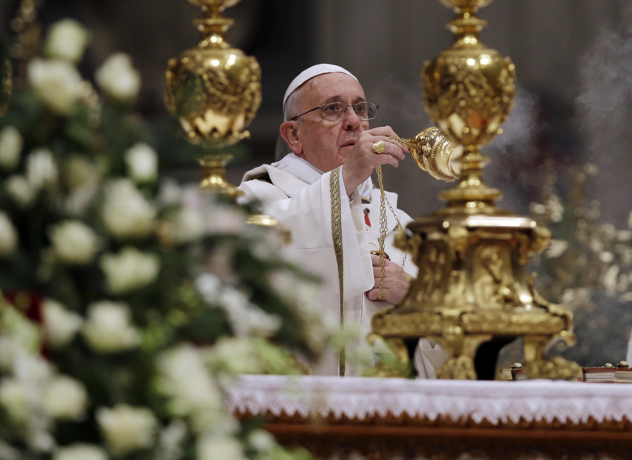 Pope Francis celebrates Christmas Eve Mass in packed St. Peter's