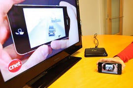 Snapstick in action on an iPhone 4 and TV monitor.