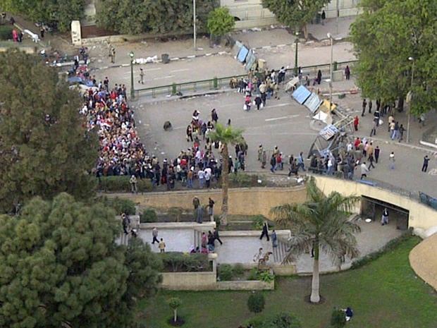 Protesters queue up to go through the military and protester checkpoints