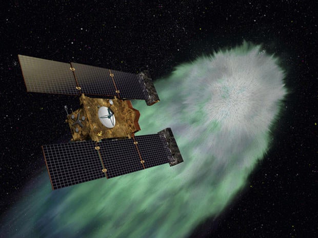 Artist illustration of NASA's Stardust-NExT spacecraft approaching comet Tempel1