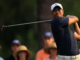 Tiger Woods hits his tee shot