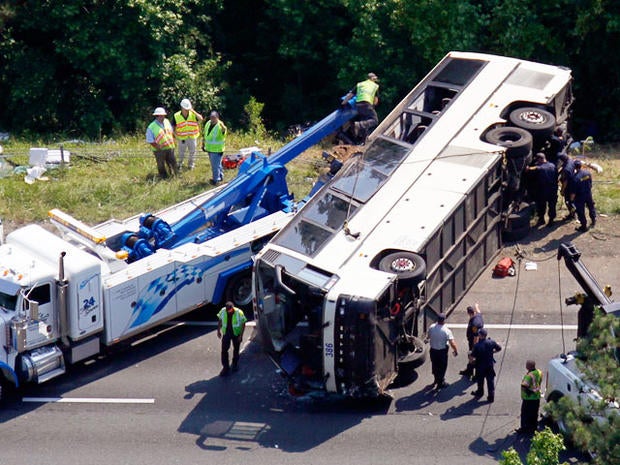 Driver charged in bus crash that killed 4, hurt dozens