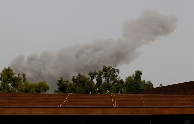 Smoke rises over Tripoli after a NATO airstrike