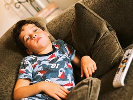 kid, boy, youth, couch potato, watching tv, lazy, bored, sloth, stock, 4x3
