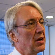 Les Hinton, chief executive officer of Dow Jones & Co., is seen at the Dow Jones New York offices Dec. 3, 2008. Dow Jones confirmed July 15, 2011, that Hinton would resign his position effective immediately. Photo credit: AP Photo