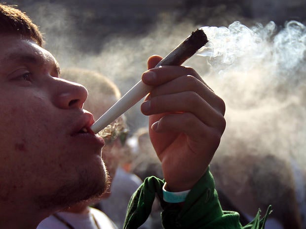 A man smokes a joint at a pro-marijuana "4/20" celebration in front of the state capitol building April 20, 2010, in Denver. April 20th has become a de facto holiday for marijuana advocates with large gatherings and "smoke outs" in many parts of the United States. Colorado, one of 14 states to allow use of medical marijuana, has experienced an explosion in marijuana dispensaries, trade shows and related businesses in the last year as marijuana use has become more mainstream.