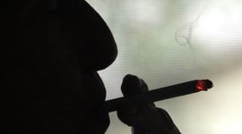 Elvy Musikka smokes a marijuana cigarette