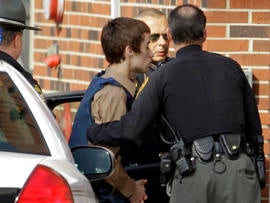 TJ Lane, a suspect in the shooting of five students at Chardon High School, is taken into juvenile court by Geauga County deputies in Chardon, Ohio, Feb. 28, 2012.