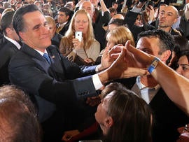 Former Massachusetts Gov. Mitt Romney greets supporters at a Super Tuesday night gathering with his family at the Westin Copley Place March 6, 2012, in Boston.
