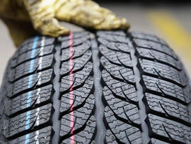 BERLIN - OCTOBER 07: The profile of a snow tire is pictured at a tire dealer on October 7, 2010 in Berlin, Germany. German drivers will be forced to make sure they have proper tyres for driving in mud and snow this winter after Transport Minister Peter Ramsauer announced a safety crackdown on Wednesday. (Photo by Andreas Rentz/Getty Images)