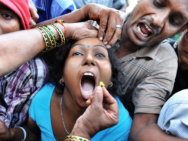 Indian Believers Swallow Live Fish As Asthma Cure Photo Pictures Cbs News