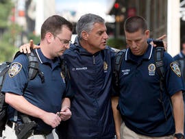 New York City police officers talk at the scene of a shooting near the Empire State Building Aug. 24, 2012, in New York City.