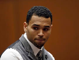 R&B singer Chris Brown in a Los Angeles courtroom on Monday, Sept. 24, 2012. Judge Patricia Schnegg has ordered a further review of Chris Brown's community service and travel to determine whether Brown has violated the terms of his probation for the 2009 beating of then-girlfriend Rihanna.