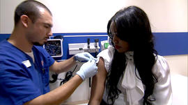 A woman gets a flu shot