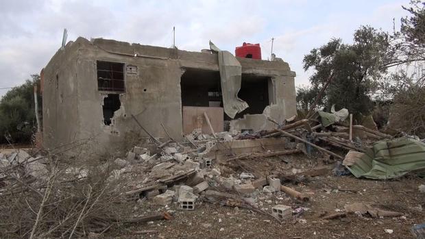 Damage from a Syrian missile in the Damascus suburbs.