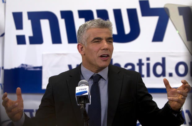 Yair Lapid, leader of the Yesh Atid (There is a Future) party, speaks to supporters