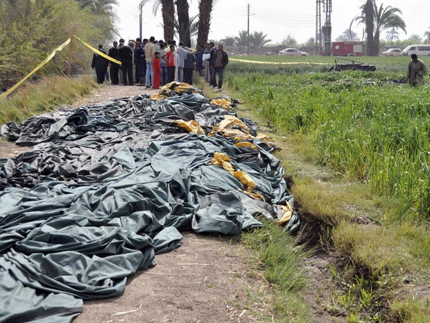 Egyptians inspect the site where a hot air balloon exploded over the ancient temple city of Luxor on February 26, 2013. The hot air balloon caught fire and exploded over Luxor during a sunrise flight, killing 18 tourists, including Asians and Europeans, sources said. The balloon carrying 21 people was flying at when it caught fire, a security official said.