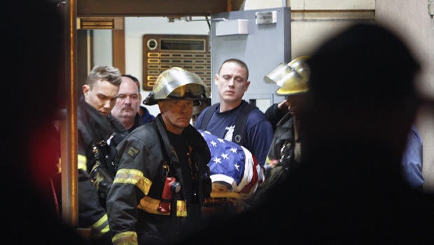 Fellow firefighters carry the body of fallen firefighter Capt. Michael Goodwin at Thomas Jefferson Hospital in Philadelphia, Saturday, April 6, 2013.