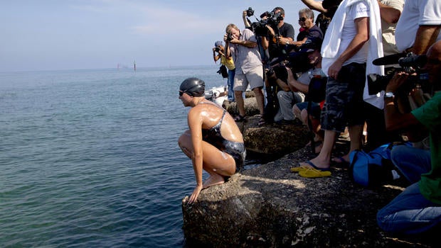 Australian swimmer Chloe McCardel jumps into the water at Hemingway Marina to start her swim to Florida from Havana, Cuba, Wednesday, June 12, 2013.