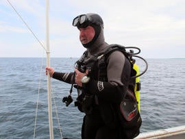 Michel L'Hour, director of France's Department of Underwater Archaeological Research, prepares to dive to what explorers believe may be the site of the Griffin in northern Lake Michigan.