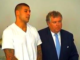 New England Patriots tight end Aaron Hernandez and his attorney, Michael Fee, appear in Attleboro District Court in Attleboro, Mass., June 26, 2013.