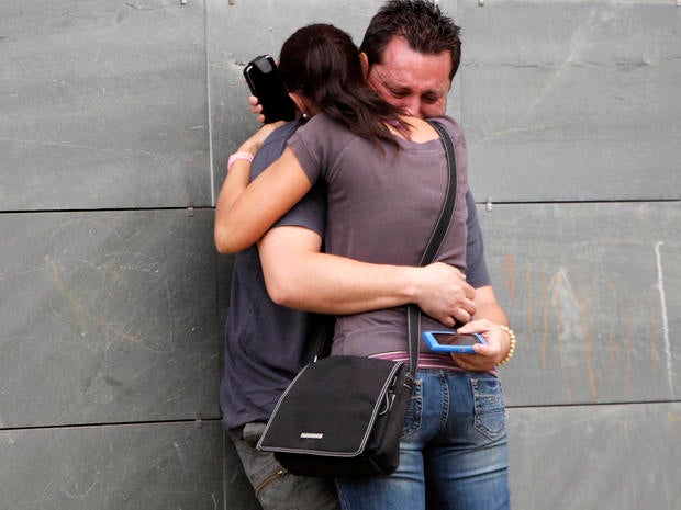 Relatives of the victims involved in a train accident react at a victims information point in Santiago de Compostela, Spain, July 25, 2013.