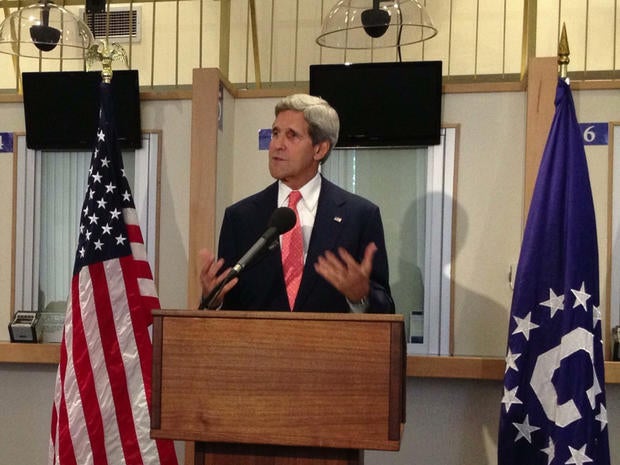 John Kerry speaks to staff at the consular visa office of the U.S. Embassy in London