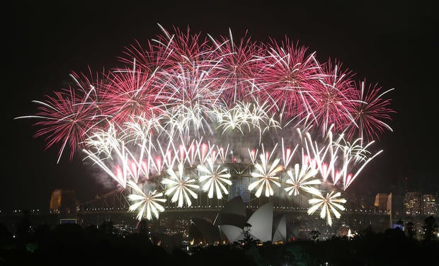 Fireworks explode over the Harbour Bridge and the Opera House during New Year's Eve celebrations in Sydney