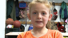 Abby Porter, 8, is seen in an interview with CBS affiliate KOAM-TV after taking the steering wheel when her mother fell unconscious in the driver's seat May 14, 2014.