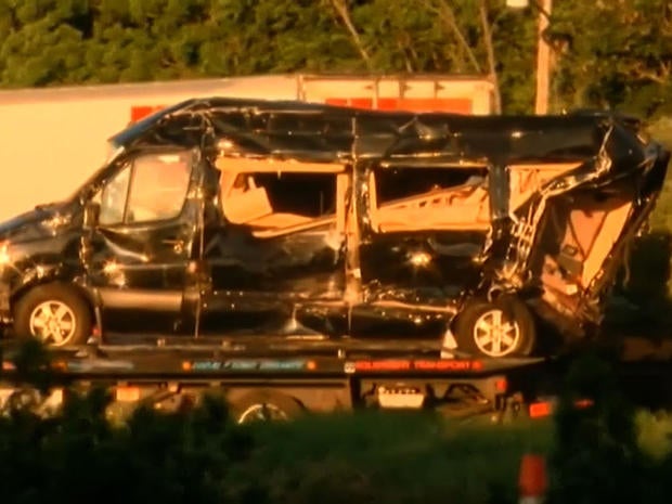 The wreckage of a limousine bus transporting actor Tracy Morgan is removed from the scene of a deadly accident on the New Jersey Turnpike June 7, 2014.