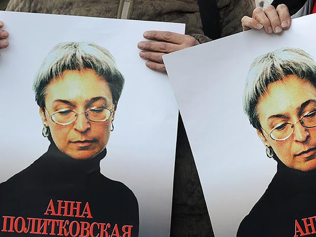 Russian human rights activists attend a rally in honor of slain Russian journalist Anna Politkovskaya in Moscow