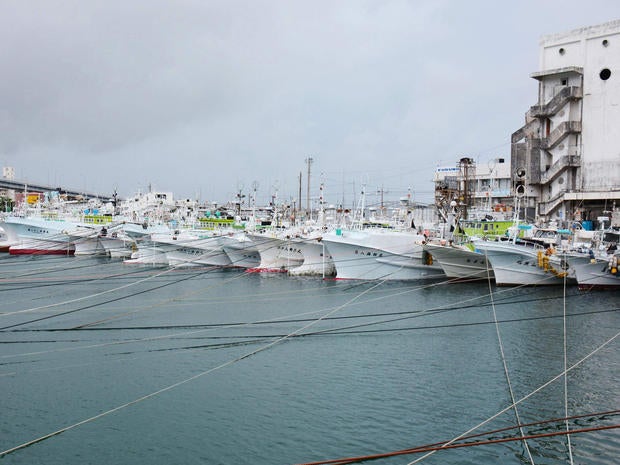 Fishing boats are moored at Tomari port in Naha, on Japan's southern island of Okinawa, as Typhoon Neoguri approaches the region