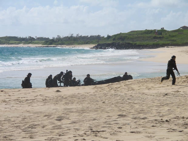 Japanese soldiers on a reconnaissance team come ashore at Kaneohe Bay, Hawaii, during amphibious landing practice July 29, 2014.