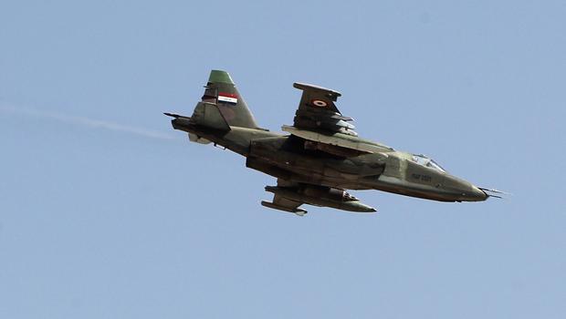 An Iraqi Sukhoi Su-25 jet flies over the town of Amerli