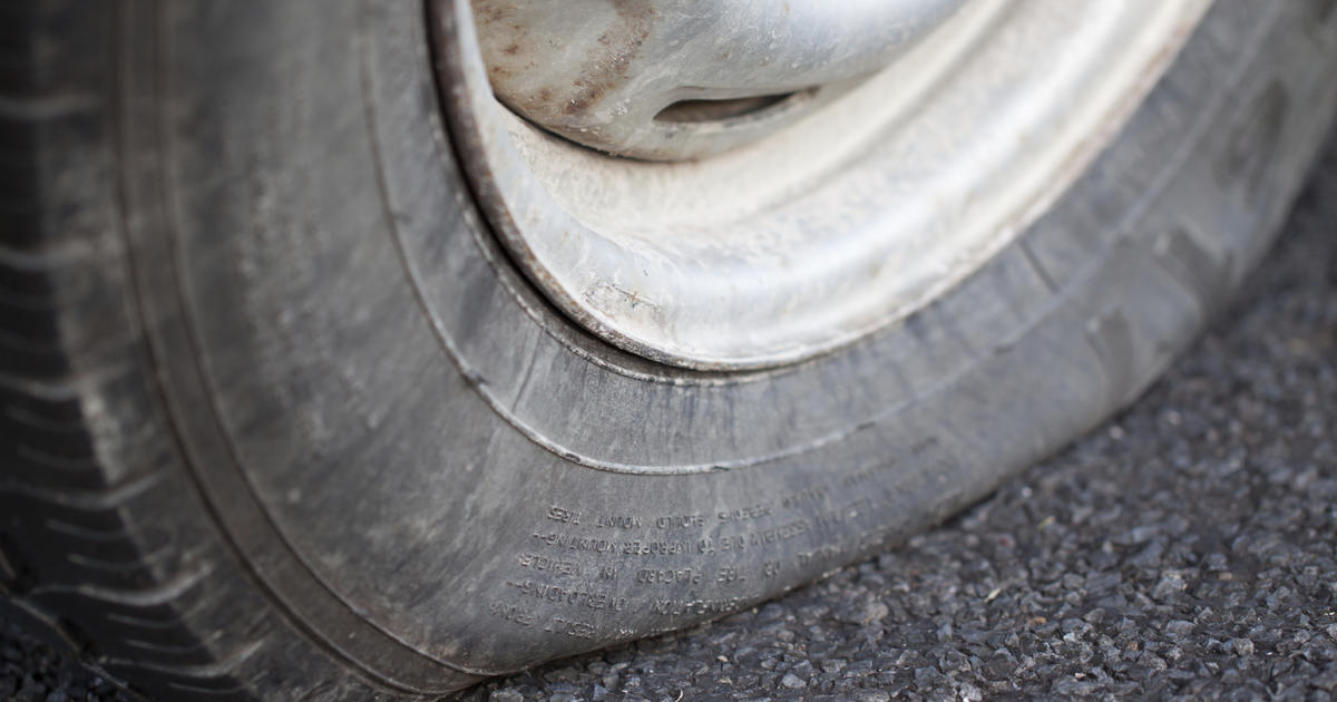 Don't know how to fix a flat tire? Thought so - CBS News