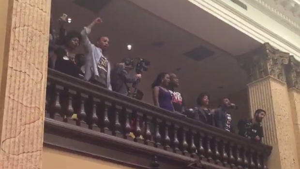 Baltimore police seen taking people from City Hall protest