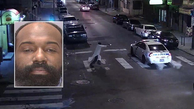 A gunman identified by police as Edward Archer, inset, fires at Officer Jesse Hartnett in his cruiser in Philadelphia Jan. 7, 2016.