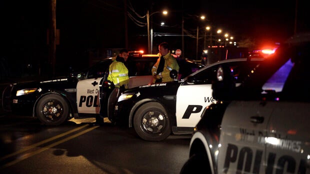 Police in Urbandale, Iowa, set up a blockade after two police officers were shot and killed in separate attacks described as “ambush-style” in Des Moines, Iowa, Nov. 2, 2016.