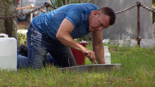 good-cemeterian-scrubbing-headstone-620.jpg