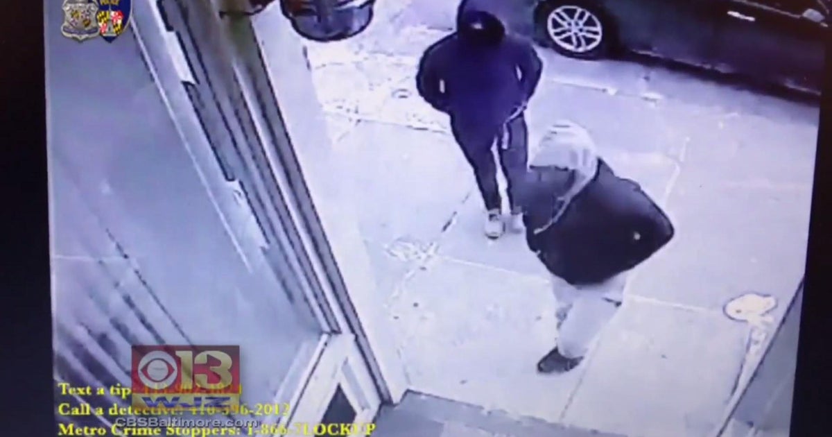 Masked suspects shoot man "execution style" in Baltimore barbershop - CBS News
