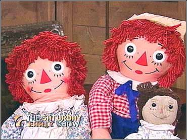 black raggedy ann doll with red hair