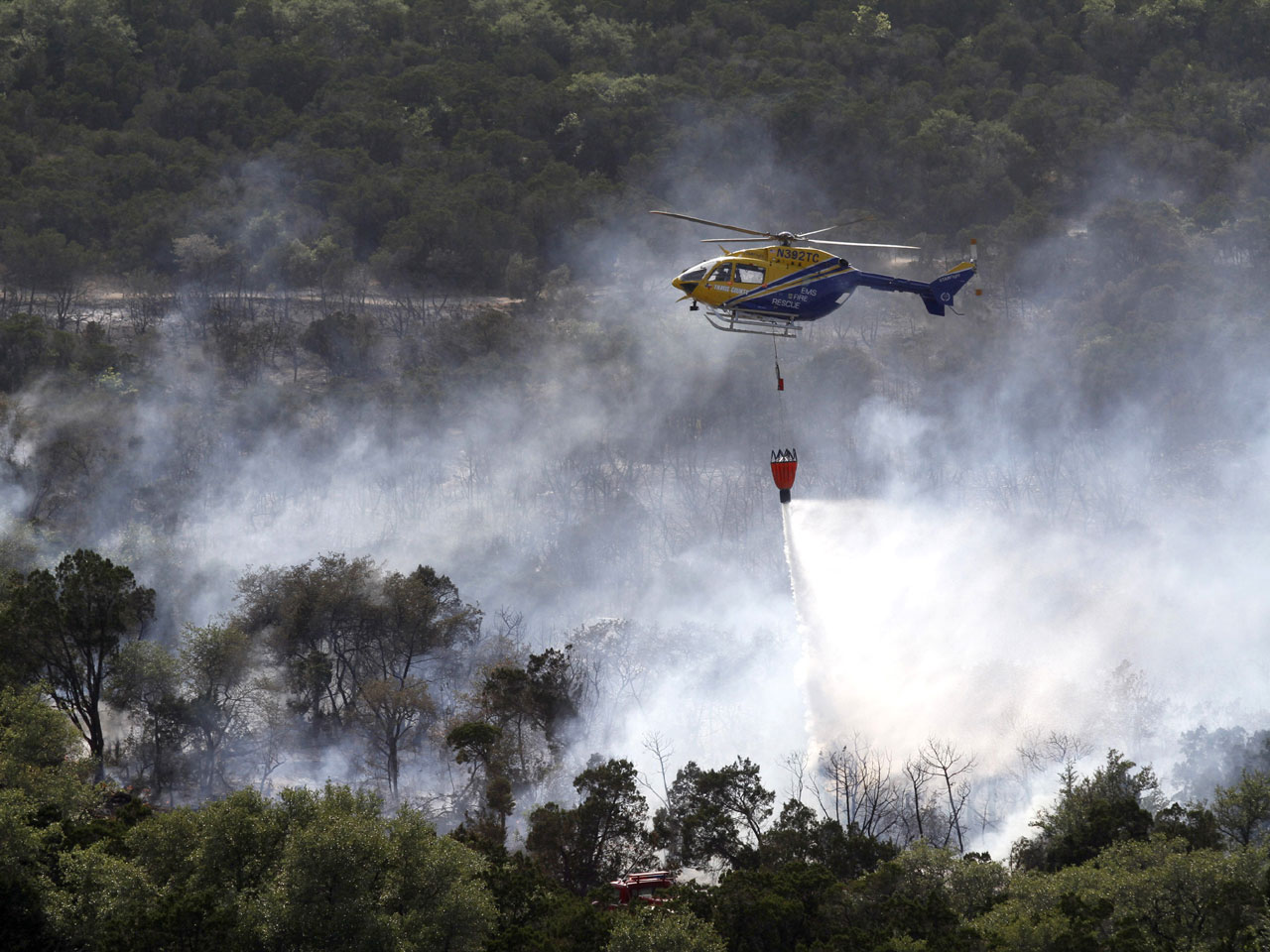 Texas wildfires reach Austin, threaten to spread CBS News