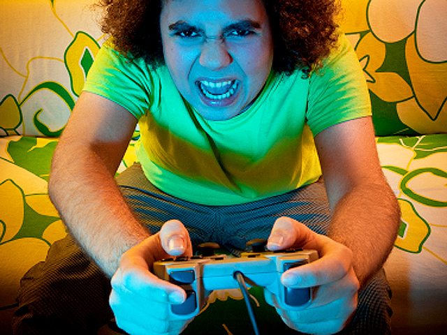 angry kid playing video games
