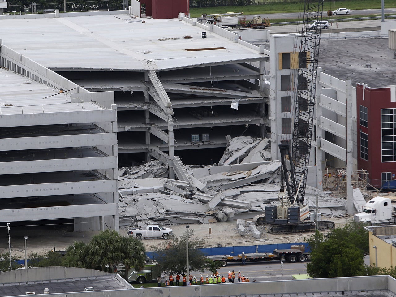 Worker freed from rubble of parking garage collapse CBS News