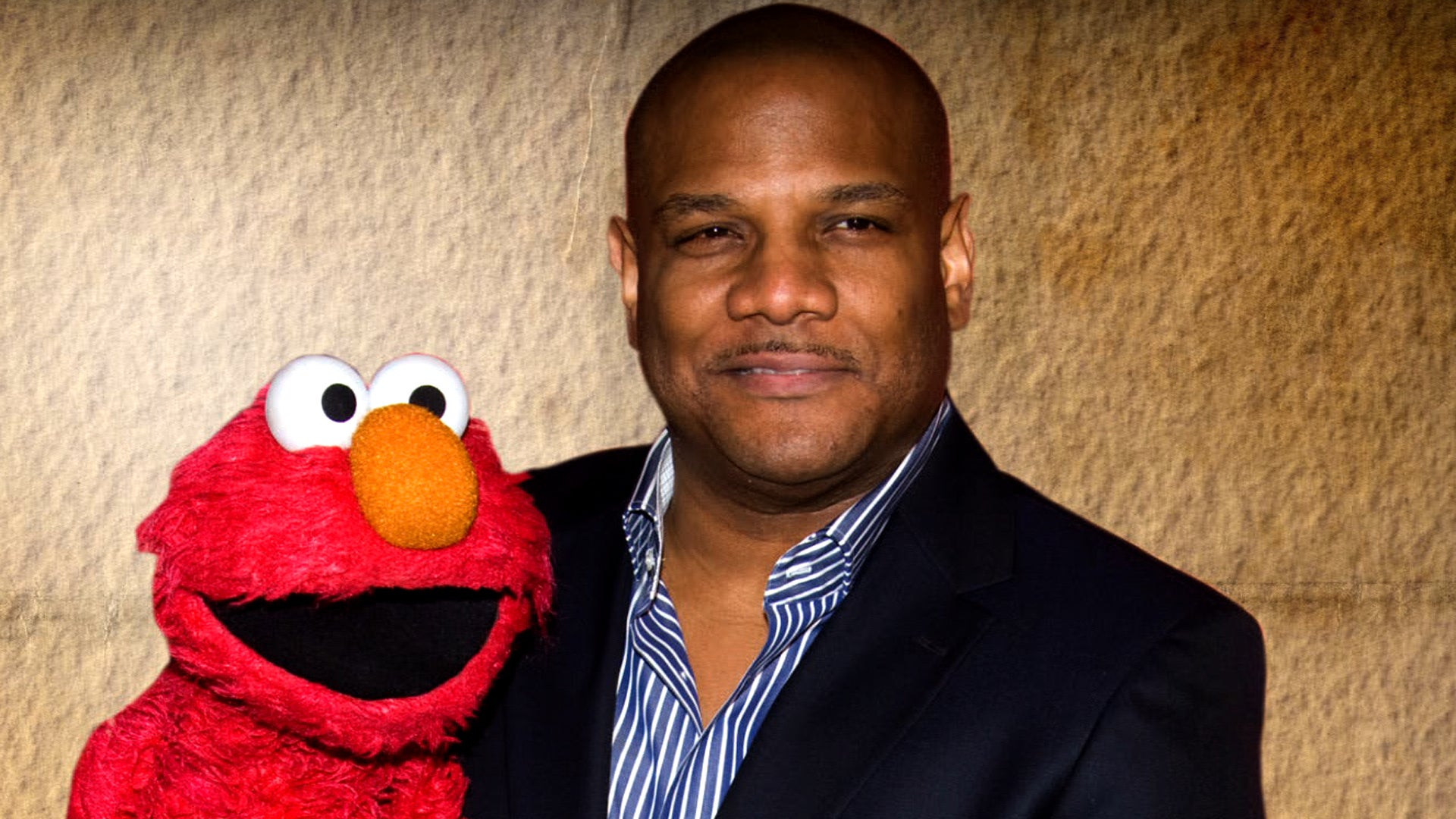 Kevin Clash, Elmo puppeteer, resigns from "Sesame Street" amid new sex