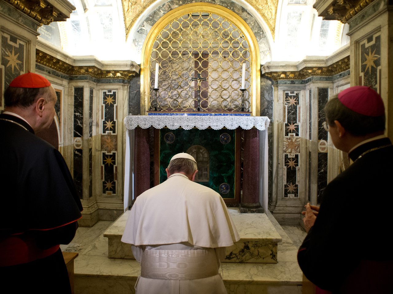 Pope Francis visits St. Peter's tomb under Vatican - CBS News